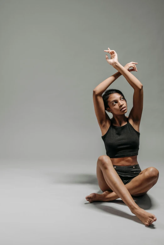 the yoga instructor is doing yoga poses in her studio