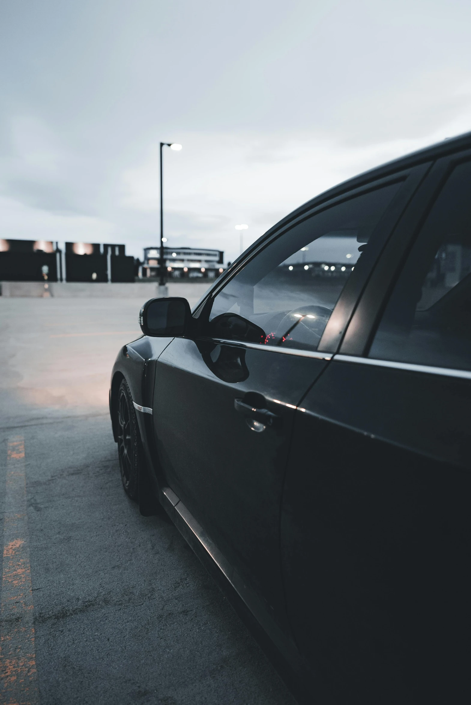 a view from the back door of a black car