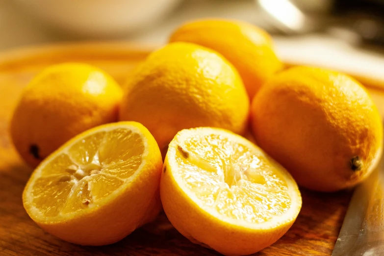 oranges sliced up on top of a  board