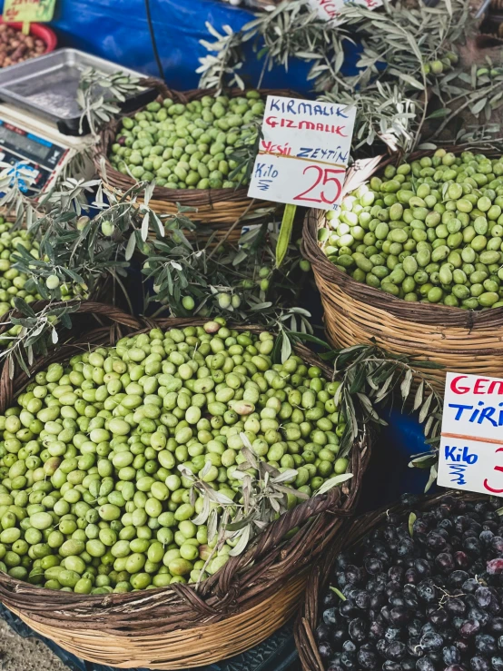 baskets full of different types of green olives