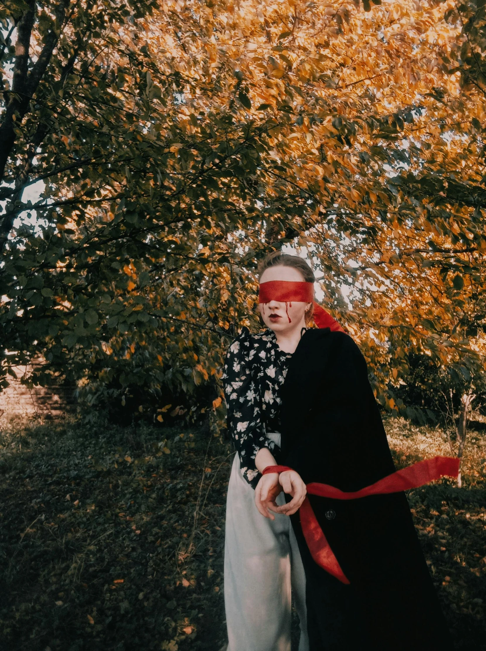 an older lady with blindfolds wearing a skirt