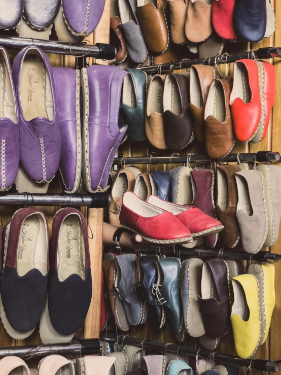 many shoes are on display in a shop