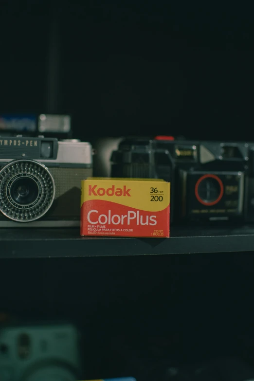 a kodak camera is displayed on a shelf