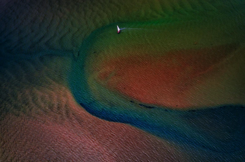 a long view of a person laying on the sand