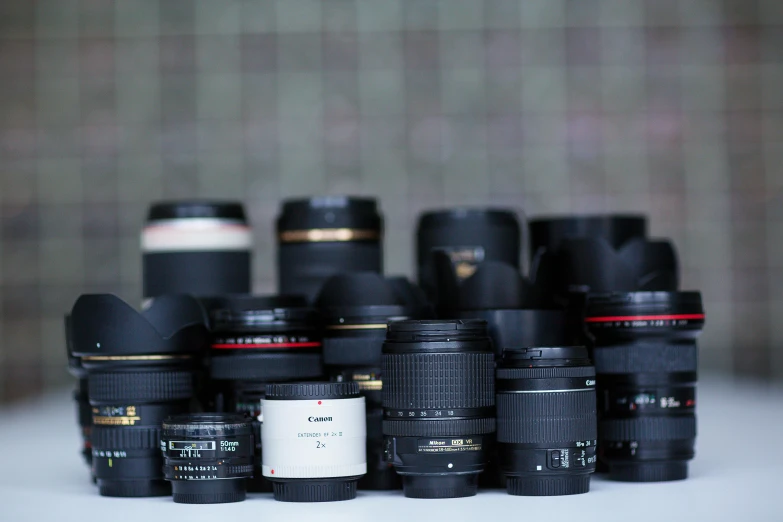 an array of cameras sitting on a table