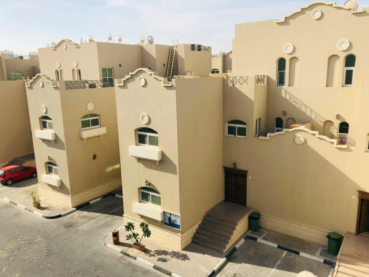 two buildings in the desert on a sunny day