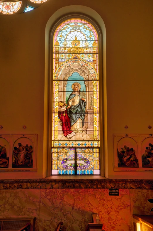 a very large stain glass window with many colorful lights
