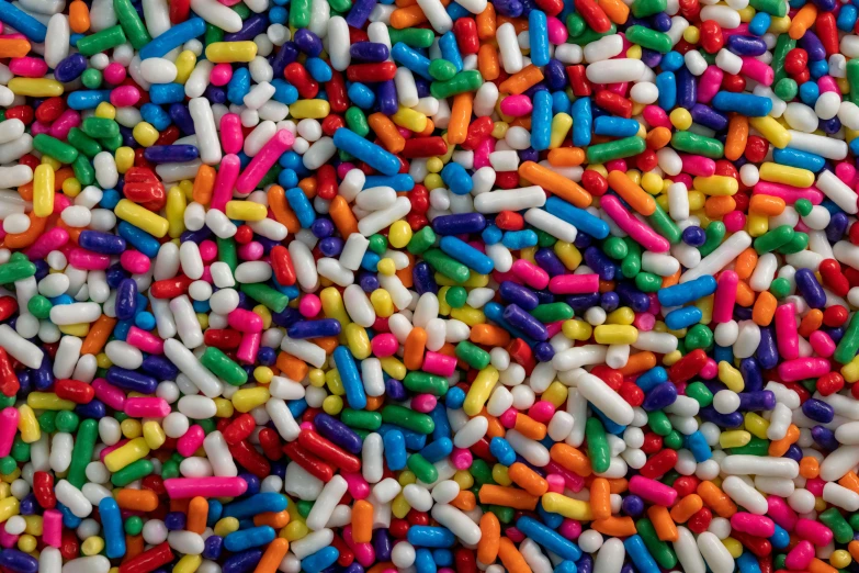 multi colored sprinkles background from above