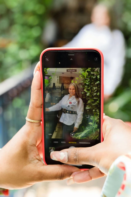 a woman is taking pictures of herself with her phone