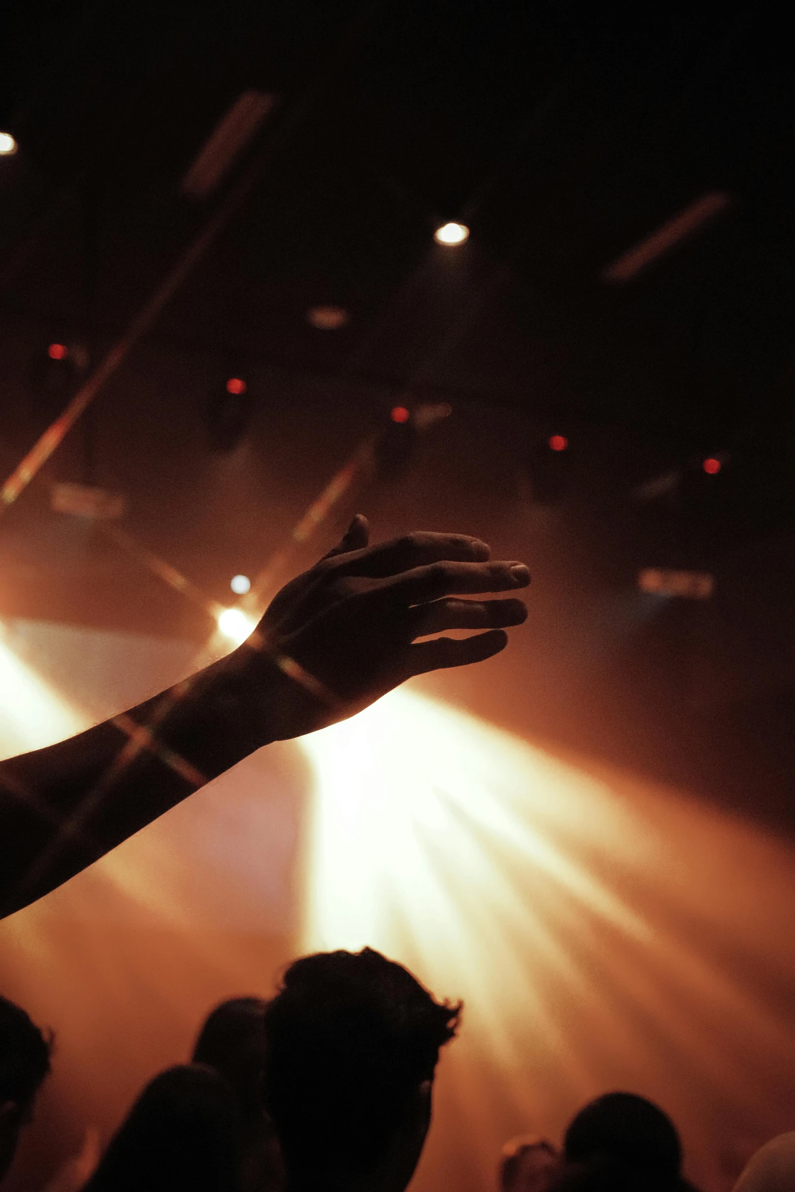 a crowd is shown in front of a spotlight