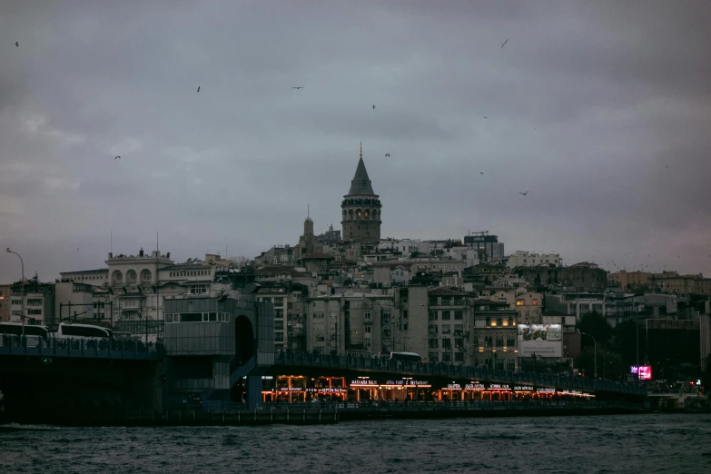 the skyline of a city with a tall building on the left side