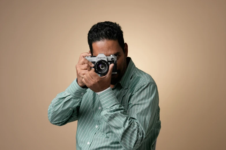 a man taking a po with a digital camera