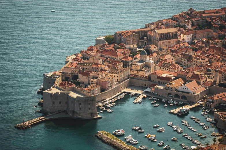 a small village sits near the edge of the water