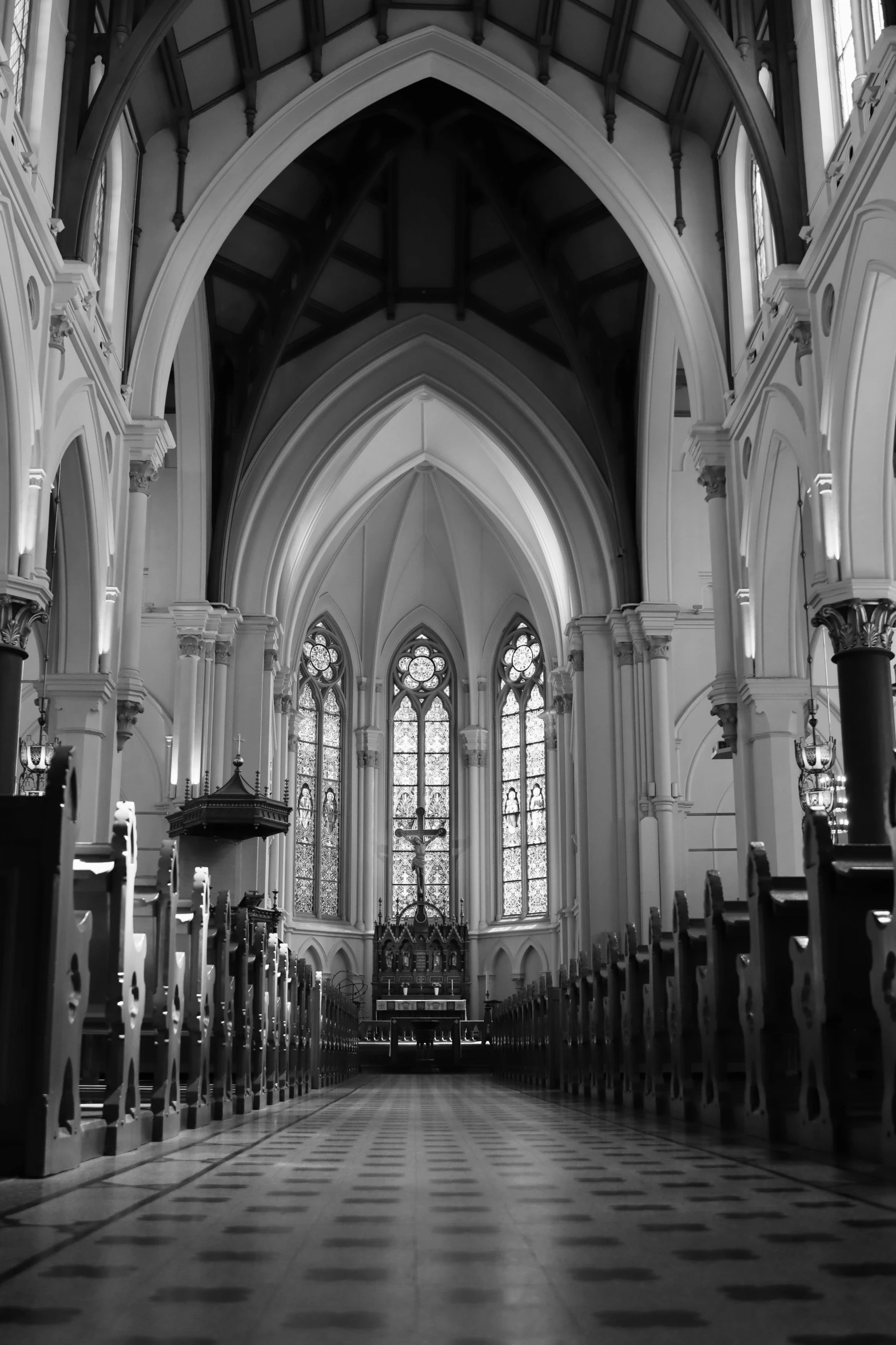 the interior of a large church with checkered tile floor