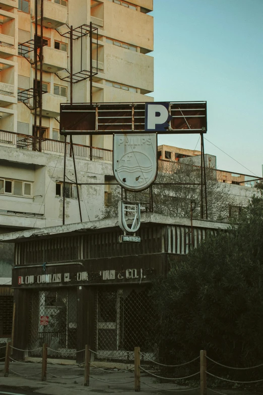 a building with a sign for a parking lot is shown