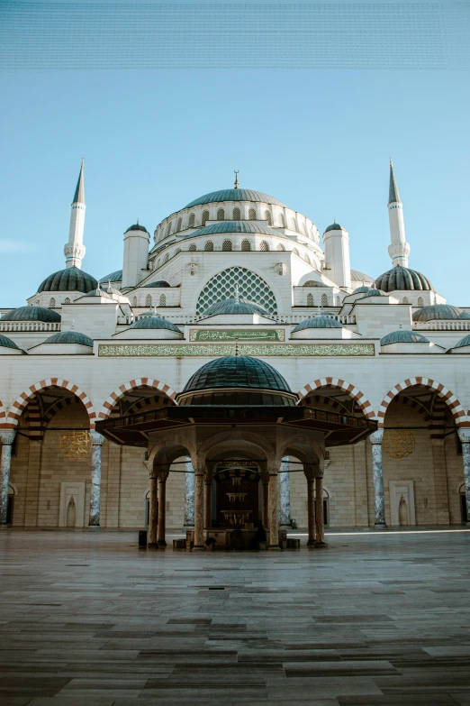 a building with arches and a domed entry way