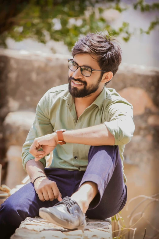 an image of a man with glasses on a bench