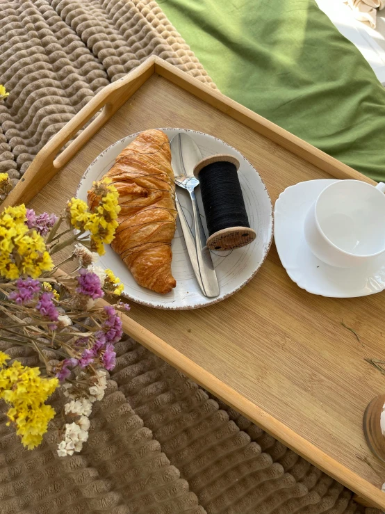 an empty tray filled with pastries and coffee