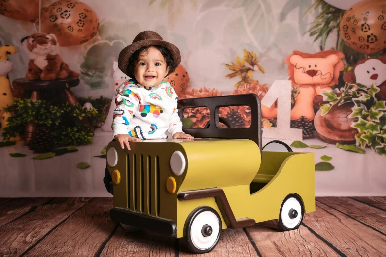 a child sitting on top of a wooden truck