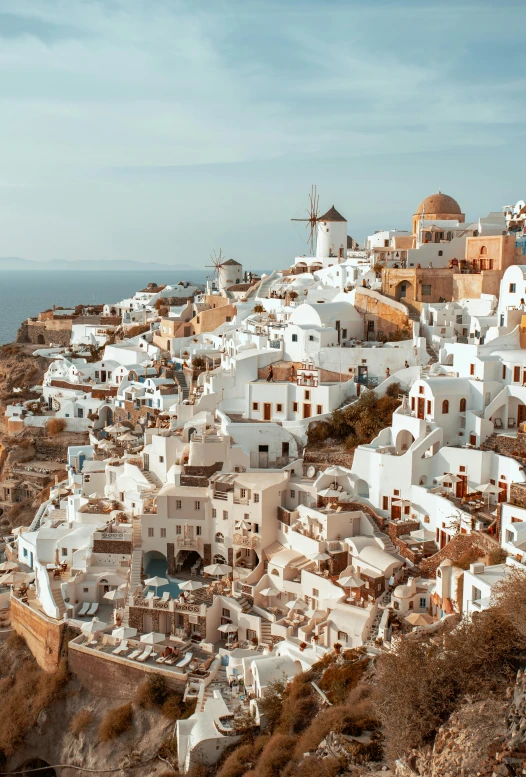 a village by the sea on top of a hill