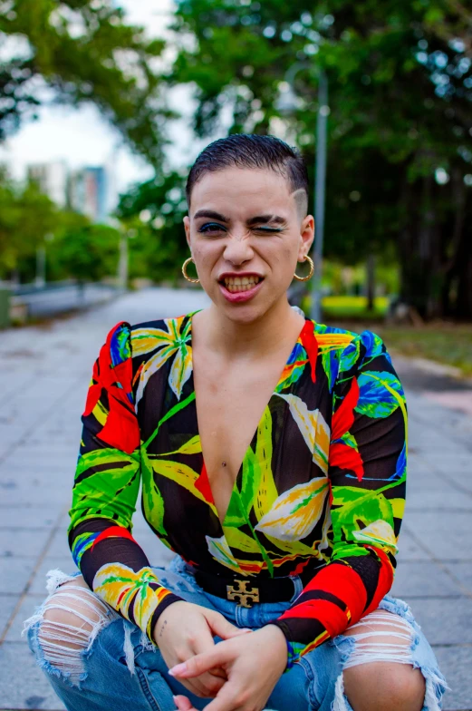 a woman sitting on a curb, with a concerned look