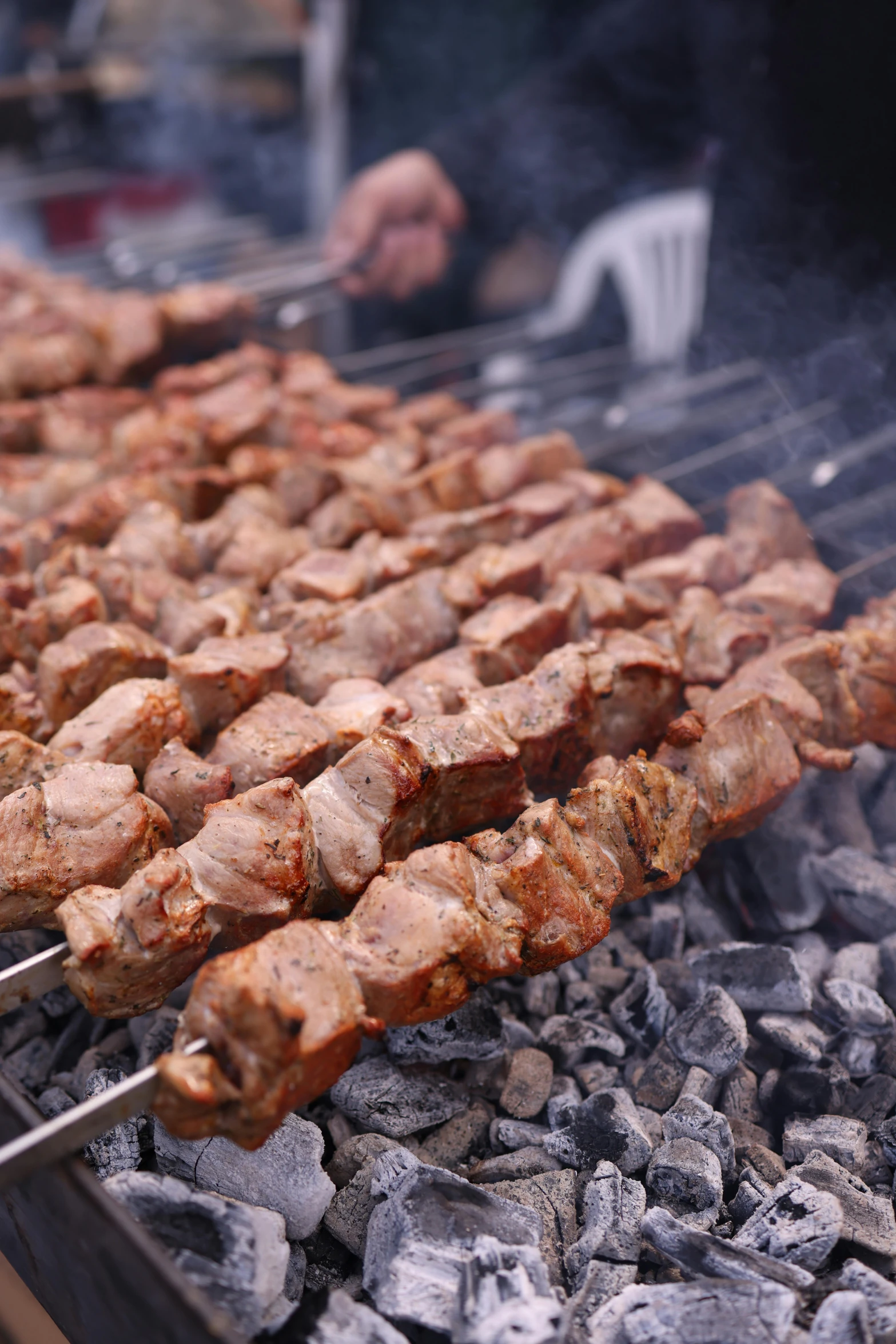 an asian style skewer grill with beef skewers being served