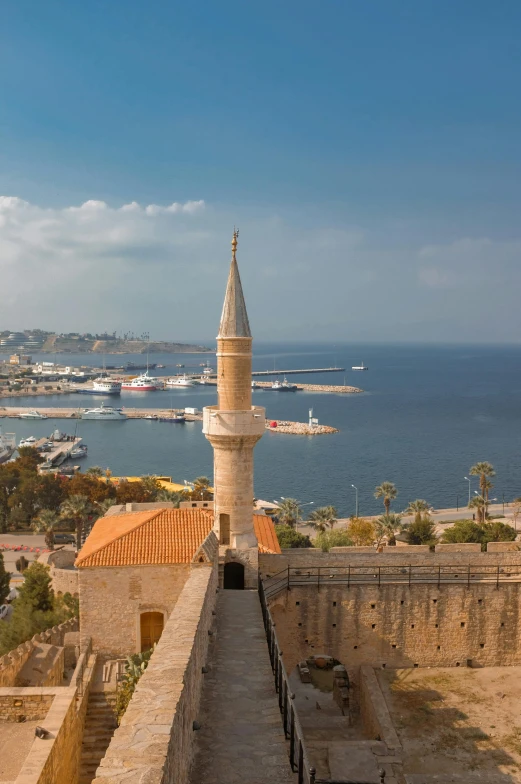 the top of a stone tower on the sea side