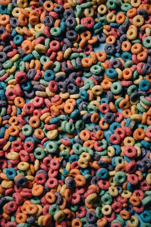 many doughnuts are scattered around on the table