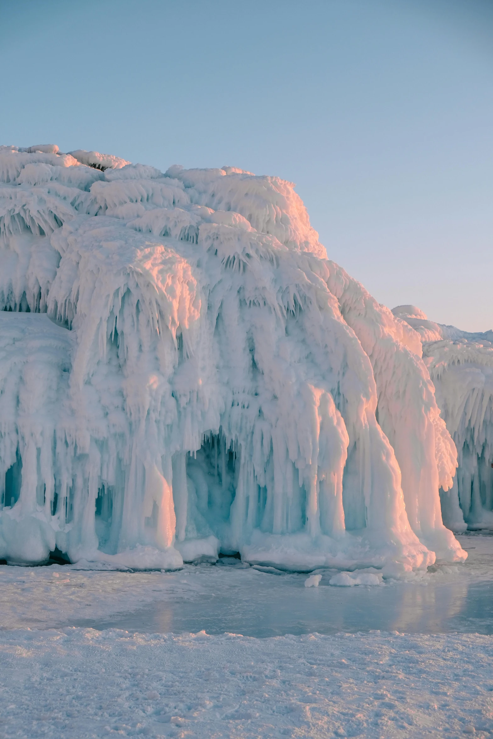 icicles are covering the surface of a river