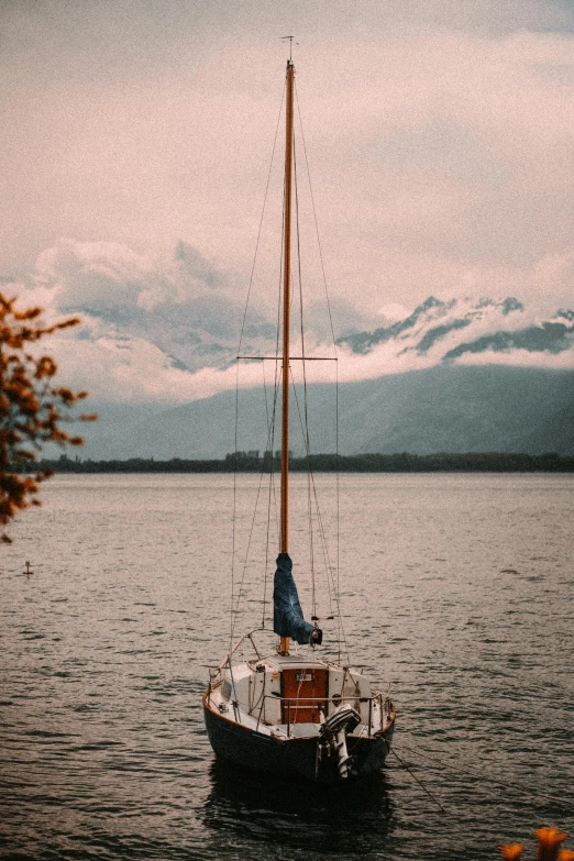 a sailboat floating in a body of water