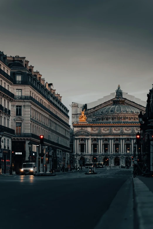 an empty street with buildings in the background