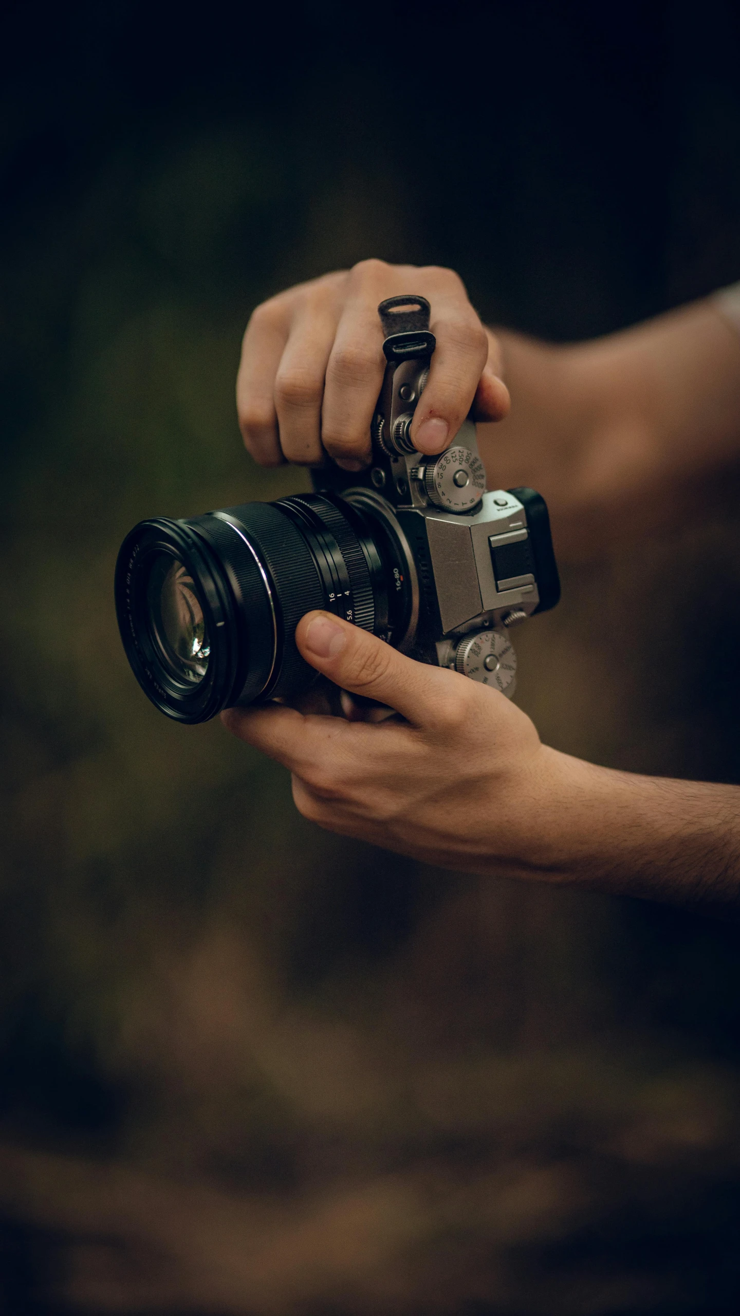 a person holding a camera with both hands