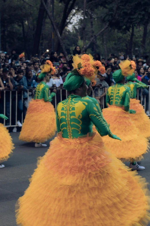 people wearing brightly colored outfits at a parade