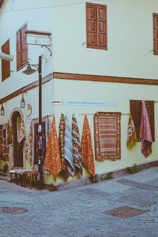 a picture of towels hanging outside of a store