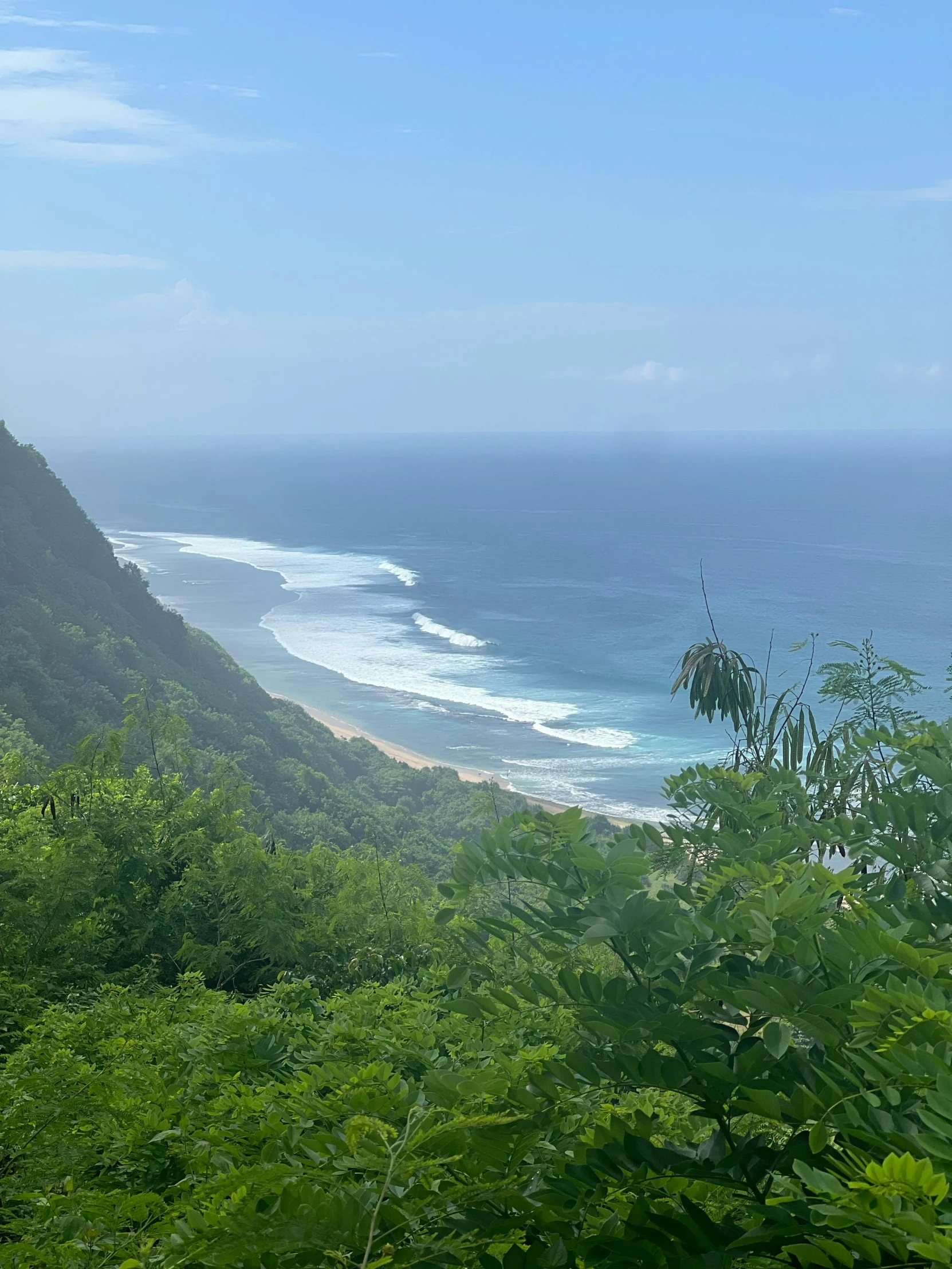 there is a sign that says the ocean below a mountain