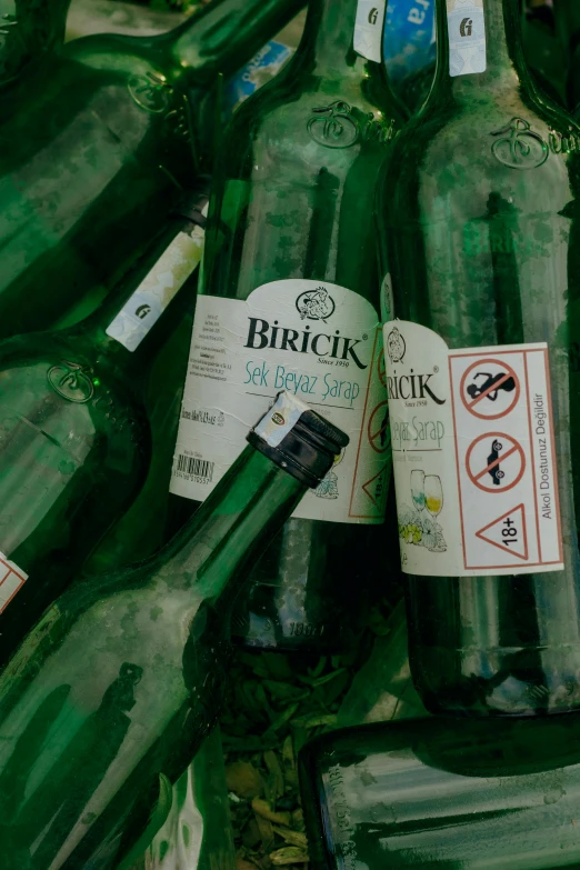 an artistic view of many open green wine bottles