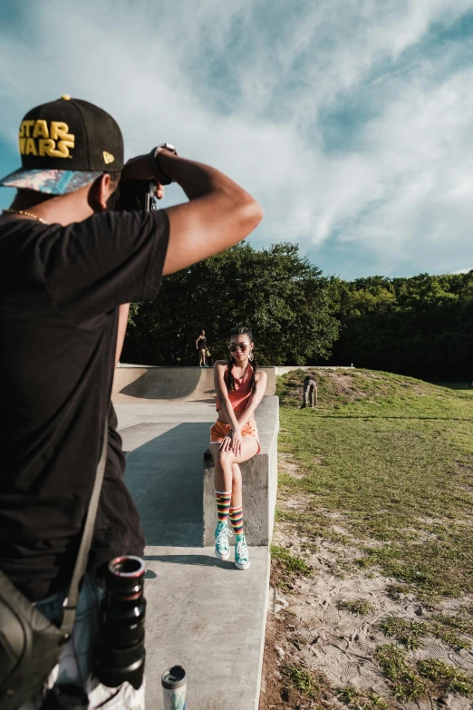 a person on a skateboard sitting down by the side of the road