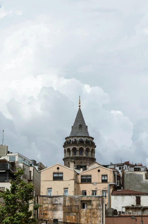 the spire on top of a building is in the distance