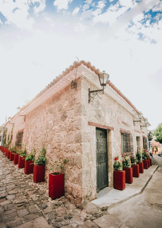 a small building that has some plants growing on it