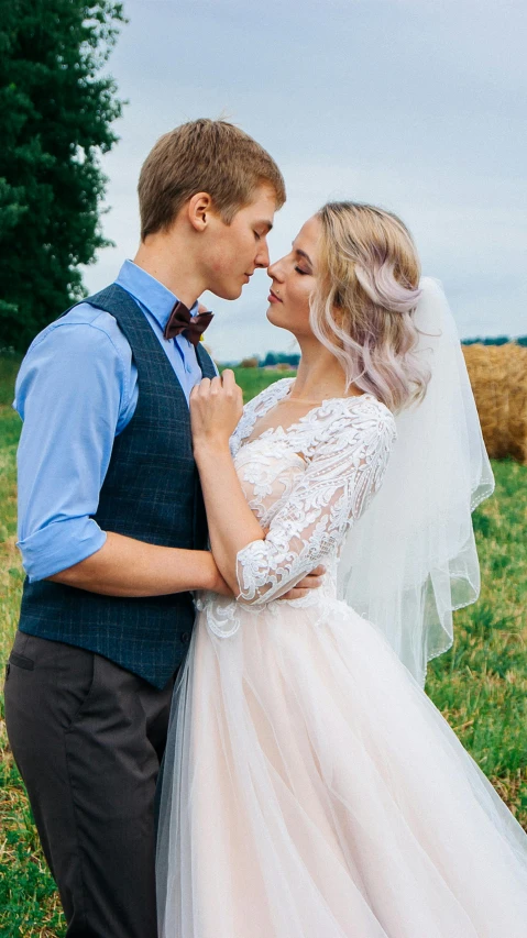 a couple is dressed in wedding clothes posing for a picture