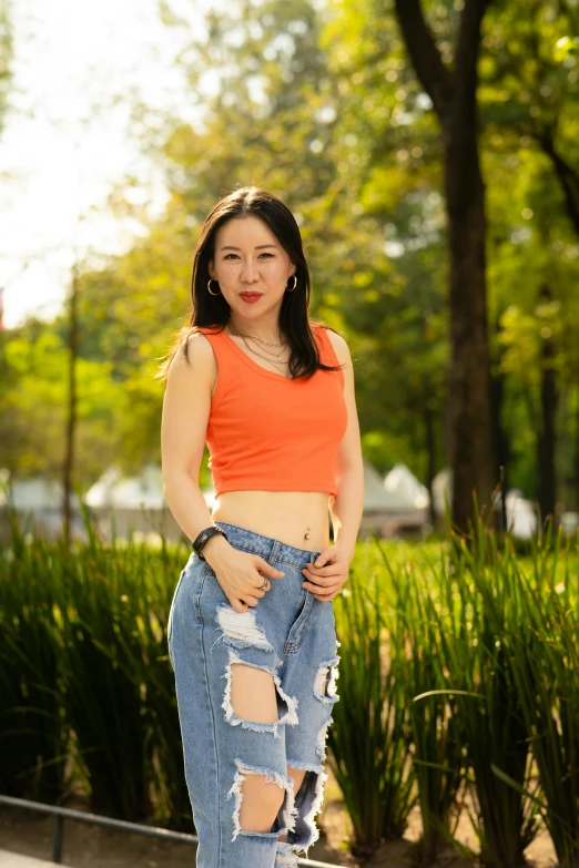 a young asian woman wearing a short skirt