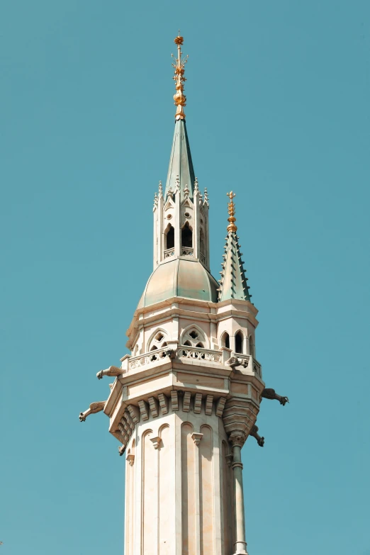 there is a steeple and spire of an old building