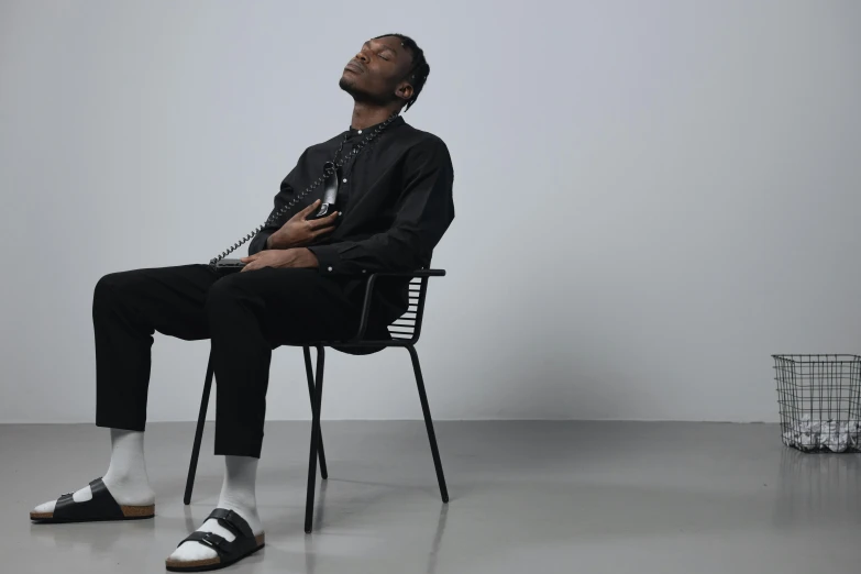 a man sitting in a chair looking up