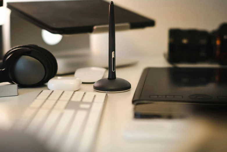 closeup of a desk top and various electronics