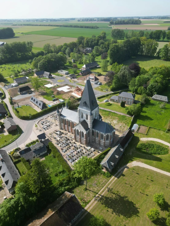 an aerial view of a church in the country side