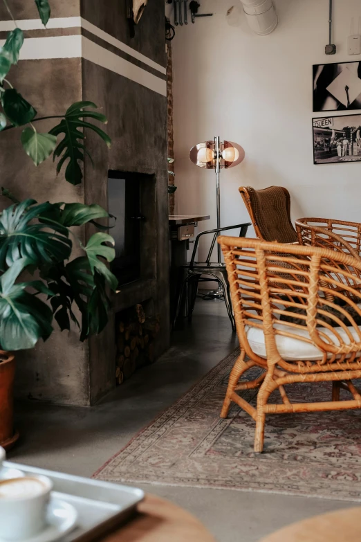 a dining area with a large window and plants