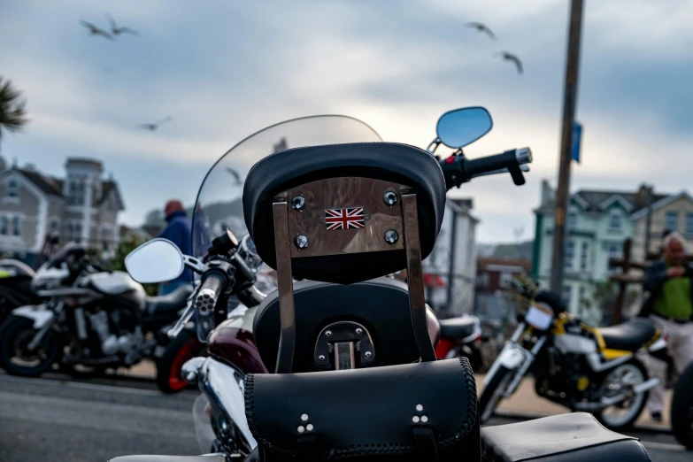 a motor cycle sitting at a road side