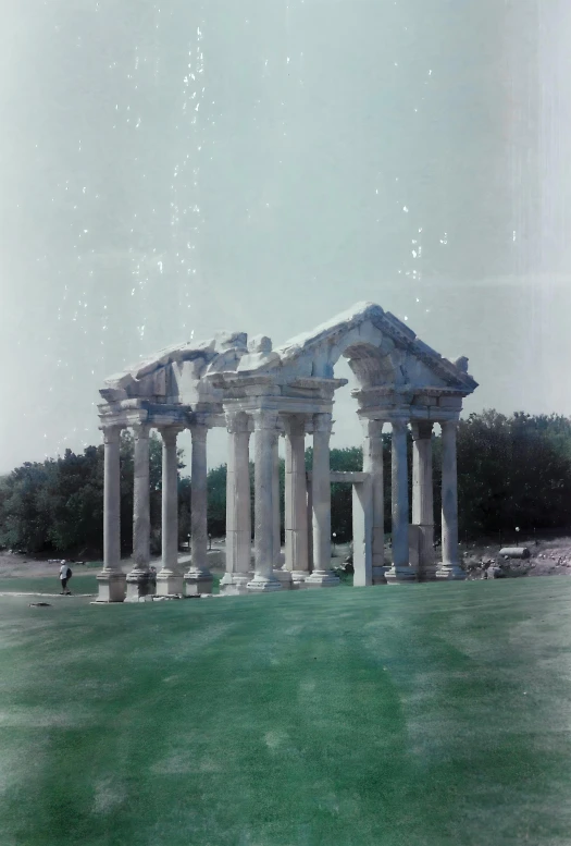 a group of large columns on a field