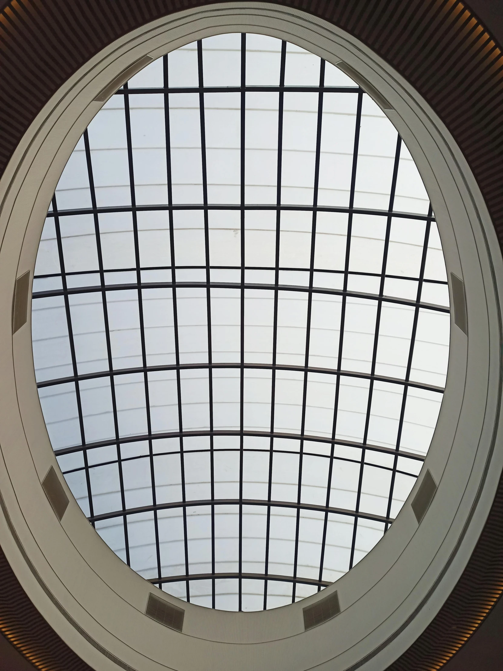 the round windows of a building are lit up