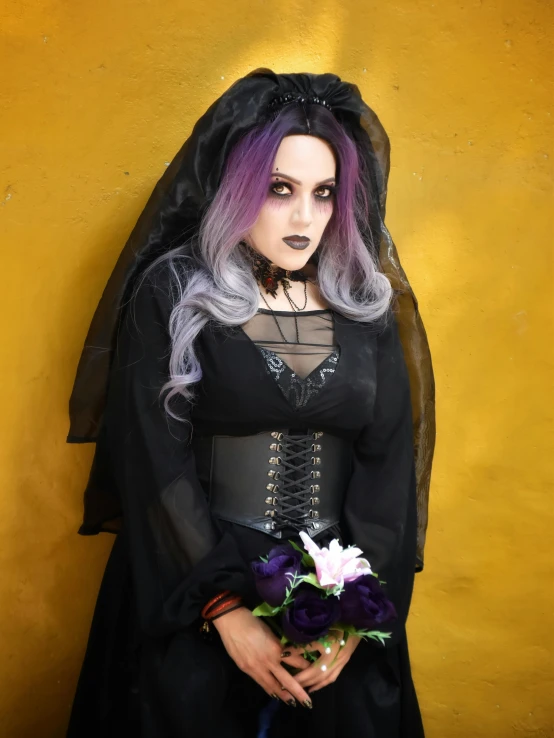 a woman with grey hair is wearing a costume and holding a flower